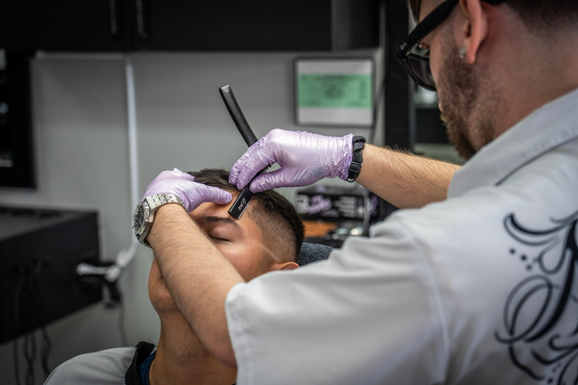 Straight razor detail work on a client's hairline